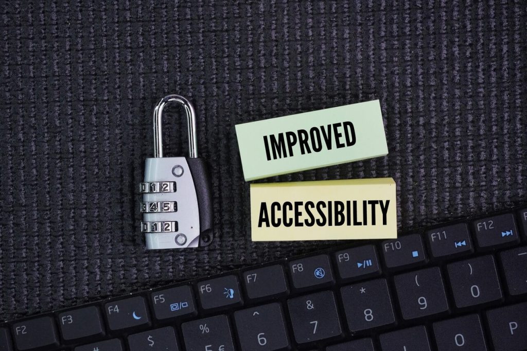 Keyboard keys and colorful notes with the words "Improved Accessibility" for easier use and access